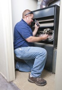technician-repairing-heater
