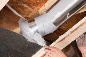 technician-sealing-HVAC-ducts